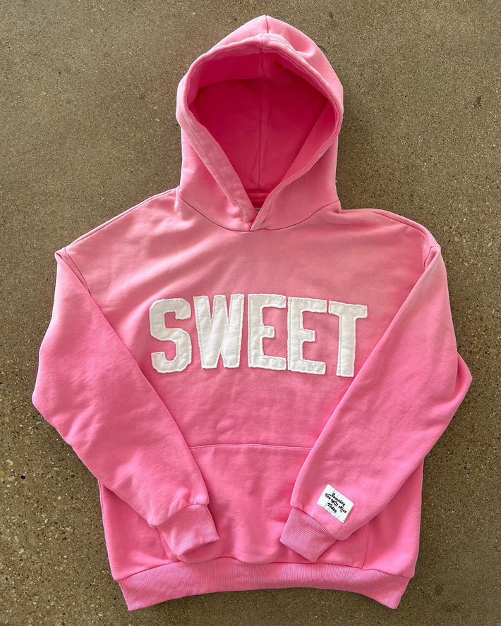 Unisex nan oversized hoodie with appliquéd letter patches and kangaroo pocket Mune Fashion