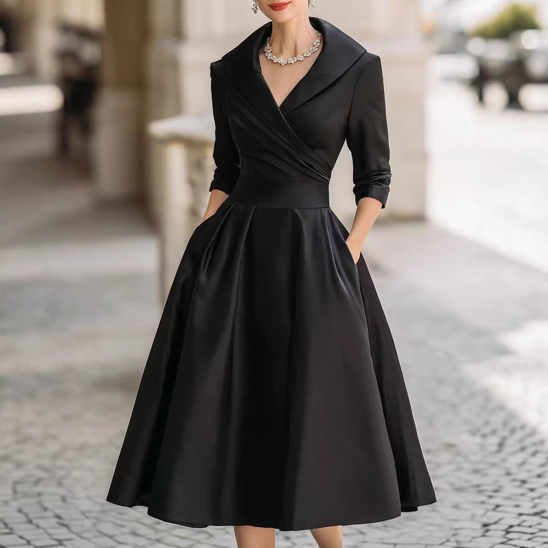 Women's elegant midi dress with wrap top, three-quarter sleeves, and side pockets Mune Fashion
