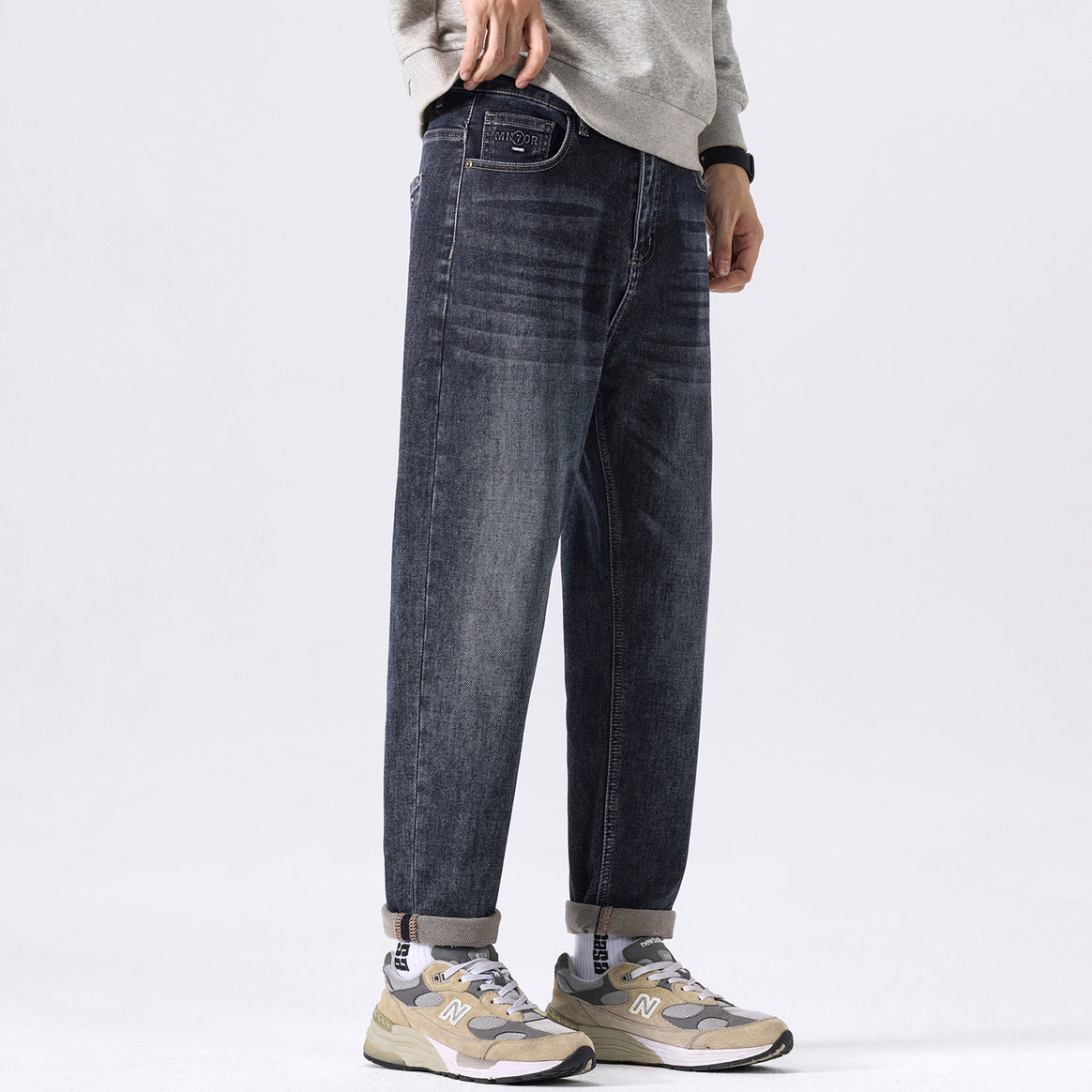 Men's tapered cut denim pants with mid-rise, relaxed fit, and subtle used look Mune Fashion
