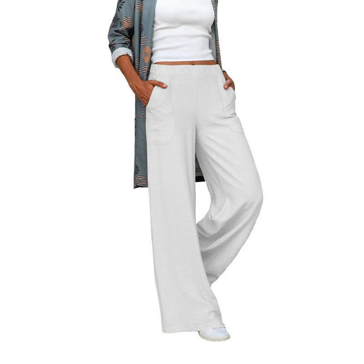 Women’s wide linen blend pants with high elastic waistband and applied side pockets Mune Fashion