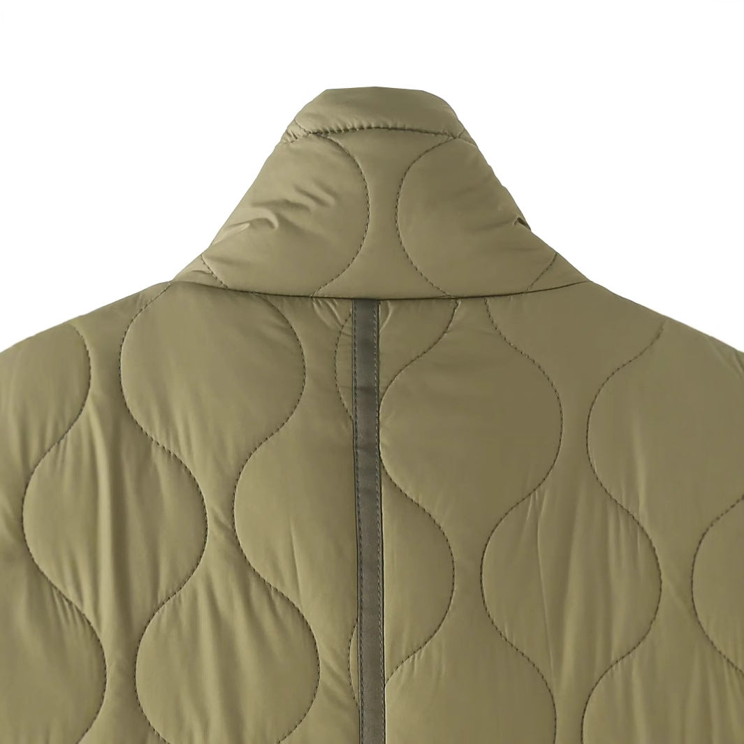 Women’s quilted short jacket with high stand-up collar, large flap pockets, and drawstring hem Mune Fashion