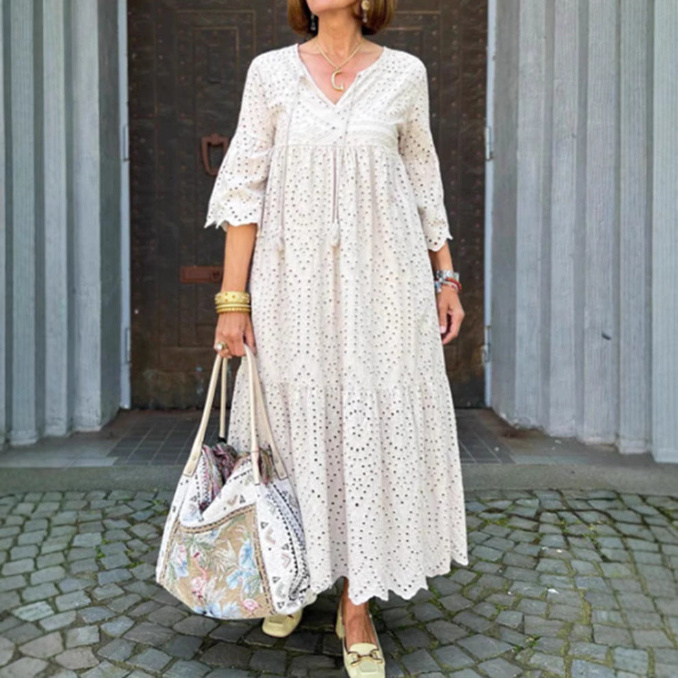 Women's flowing maxi dress with openwork embroidery, V-neck, underbust seam, and ruffled skirt Mune Fashion