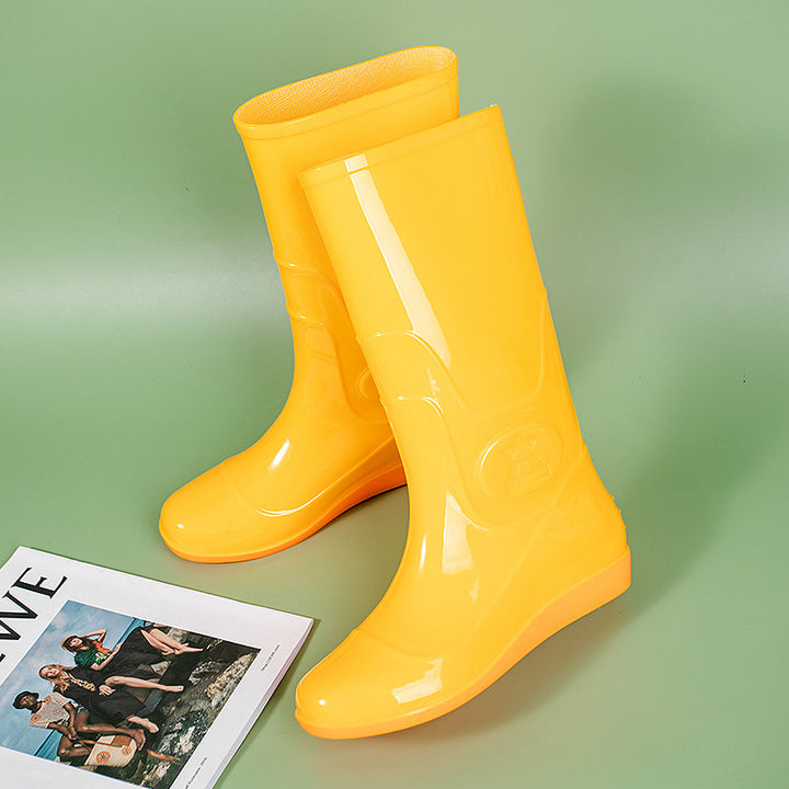 Women Shiny mid-height rain boots made of PVC with a lightweight wedge heel Mune Fashion