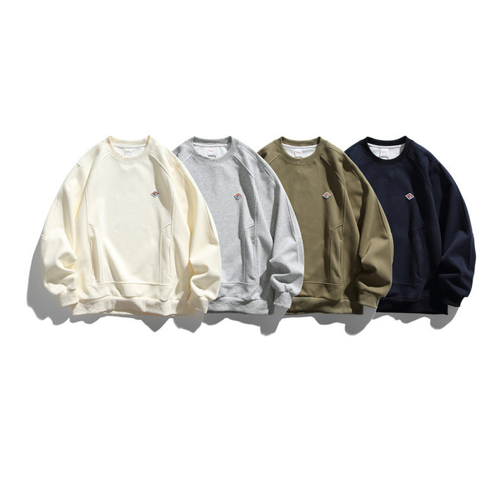 Unisex Oversize sweatshirt made of French terry with raglan sleeves, concealed side pockets, and a small logo patch Mune Fashion