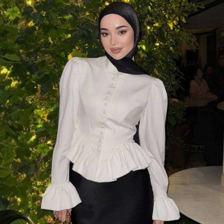 Ladies tailored peplum blouse with stand-up collar, covered button placket and puff sleeves Mune Fashion