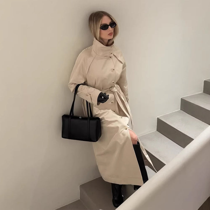 Ladies maxilength trench coat with high stand-up collar, double-breasted button placket and tie belt Mune Fashion