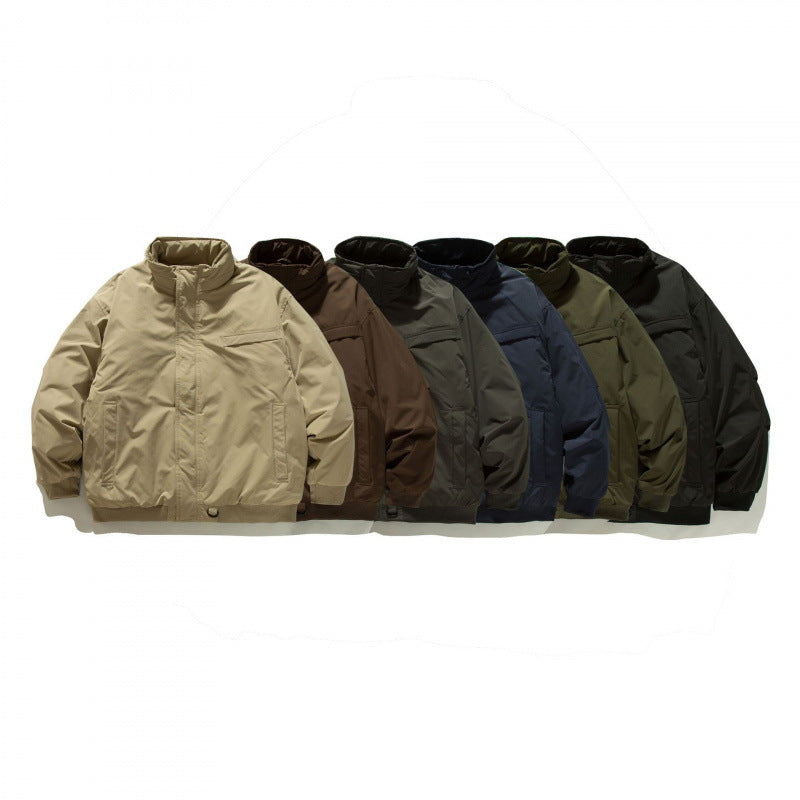 Unisex Boxy-padded transition jacket with high stand-up collar and utility pockets Mune Fashion