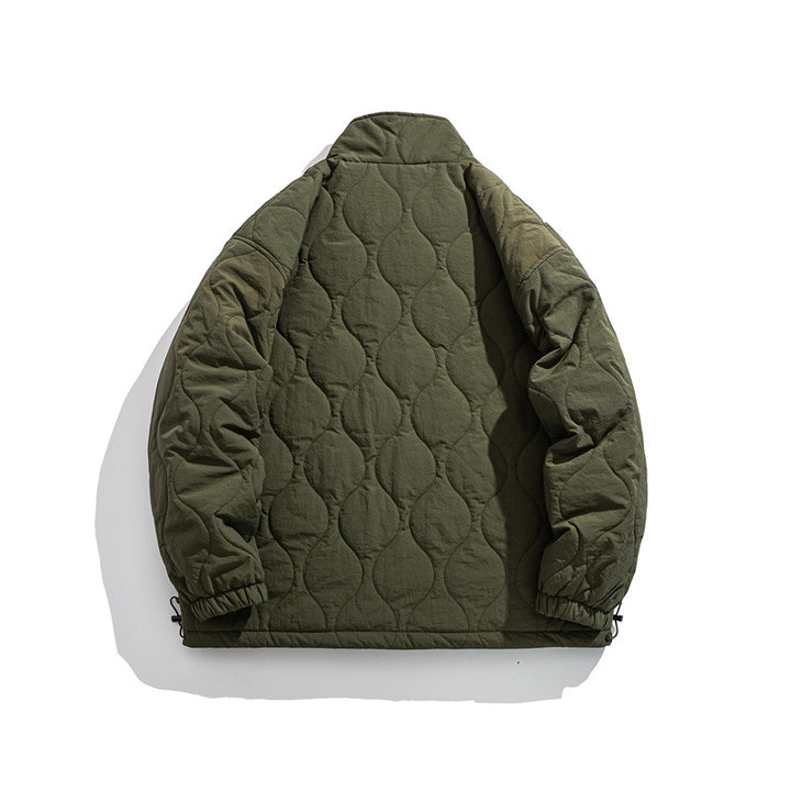 Unisex Boxy quilted jacket in military liner style with high stand-up collar and adjustable hem Mune Fashion