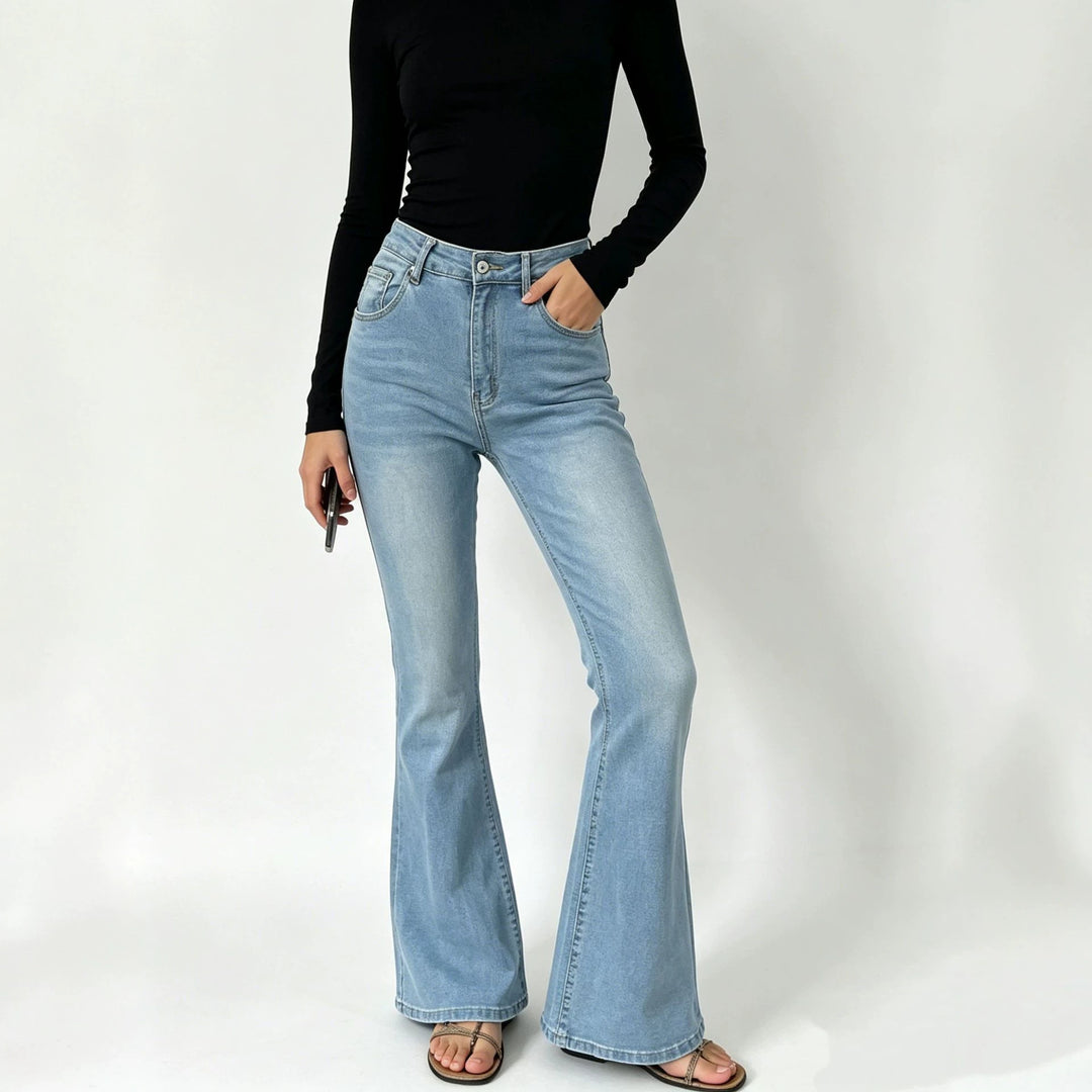 Ladies high-waisted jeans with a narrow hip area and wide flare with elastic waistband Mune Fashion