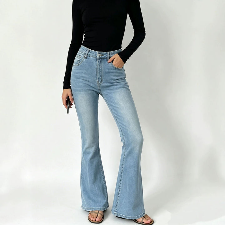 Ladies high-waisted jeans with a narrow hip area and wide flare with elastic waistband Mune Fashion