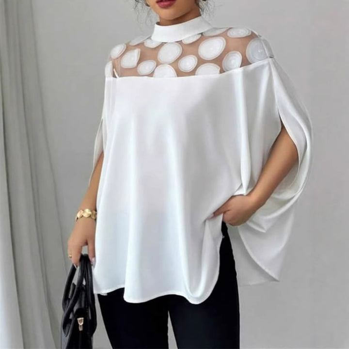 Women’s loose-fitting blouse with transparent round appliqué insert and cape sleeves Mune Fashion