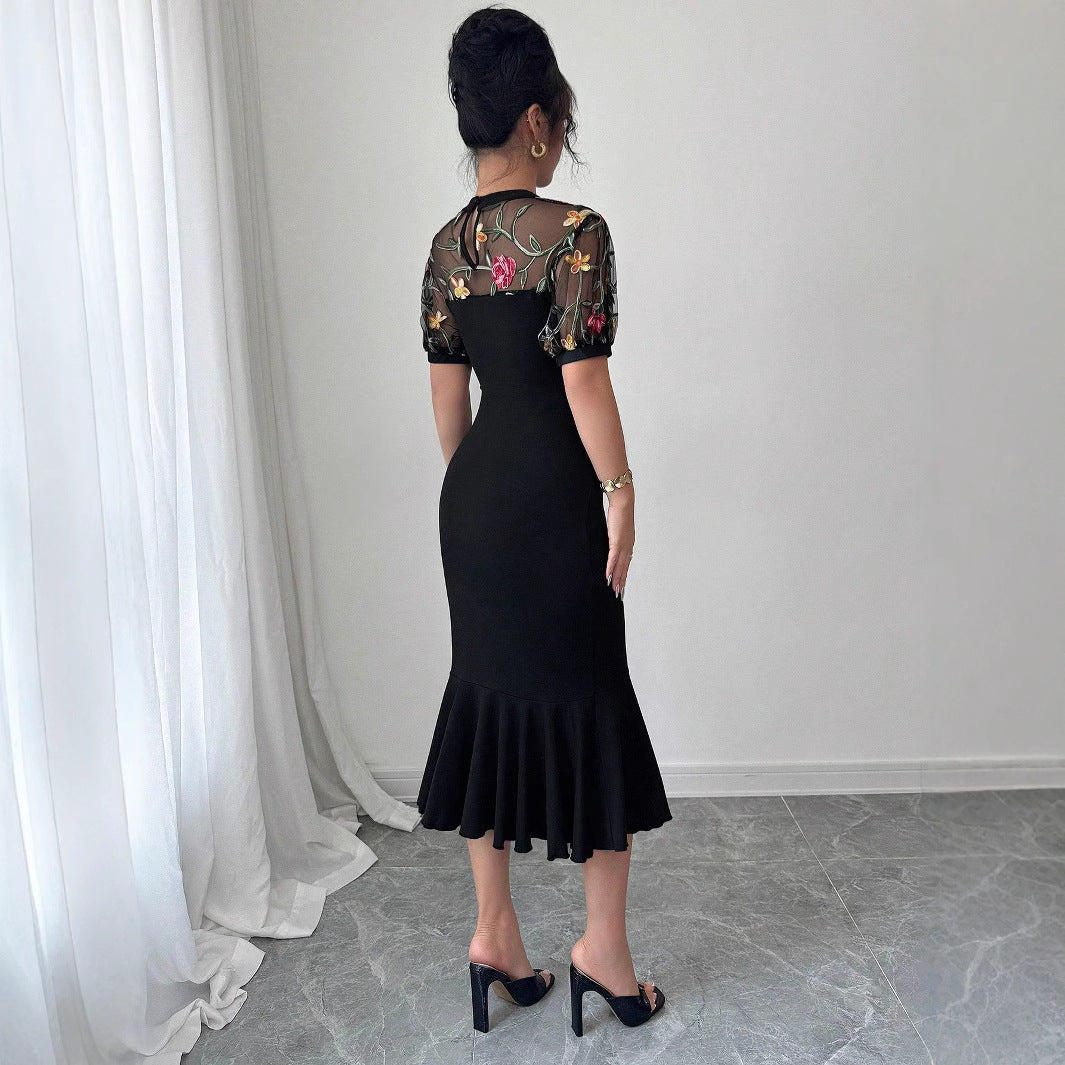 Women's figure-hugging midi dress with embroidered mesh top, puff sleeves, and asymmetrical ruffled hem Mune Fashion