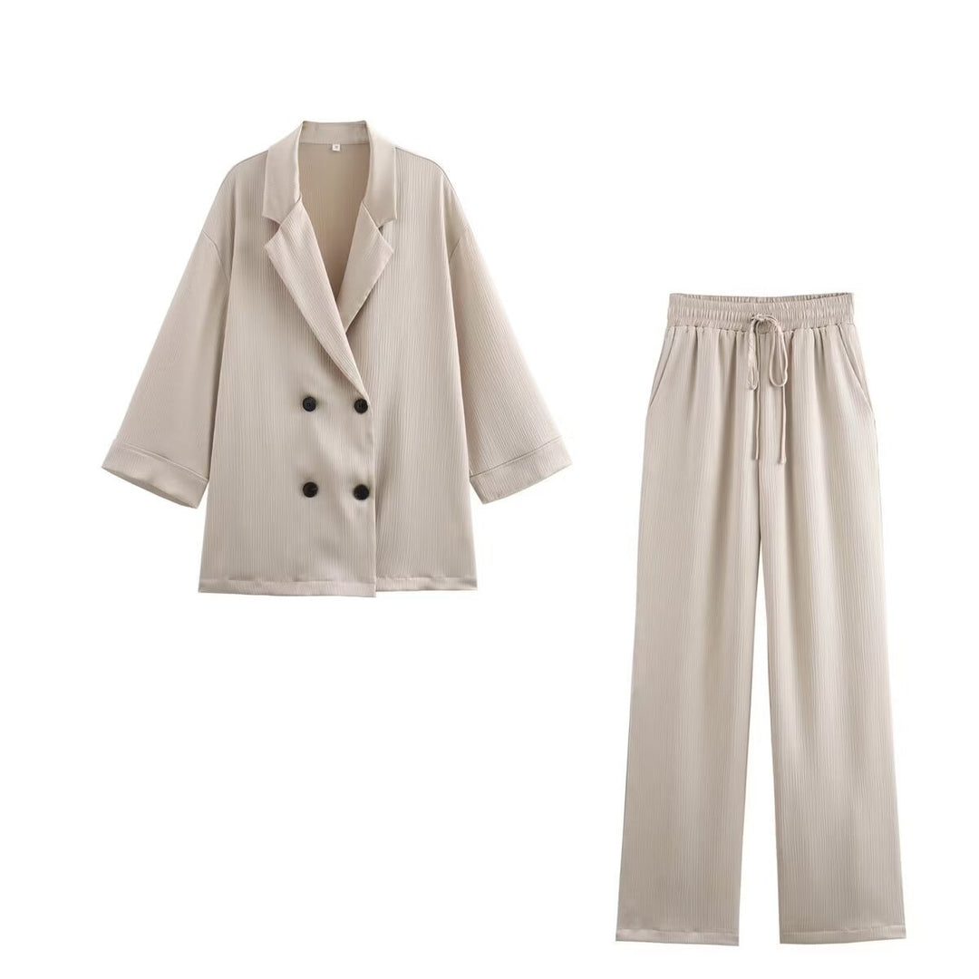 Women's pleated high-waist palazzo pants with elastic waistband, drawstring, and side pockets Mune Fashion
