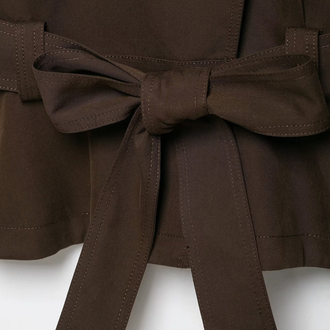 Women's short trench coat with high stand-up collar, tie belt, and asymmetrical button placket Mune Fashion