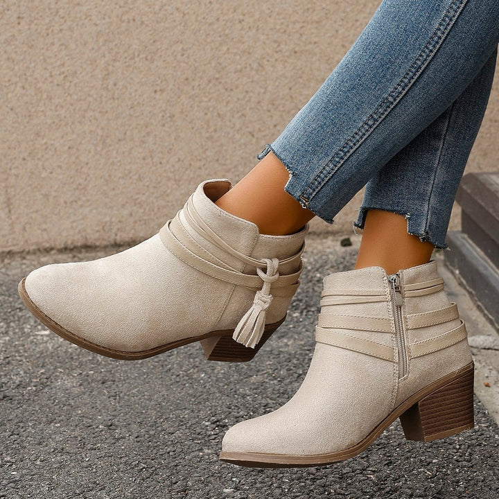Ladies faux suede ankle boots with decorative straps, tassels, and side zipper Mune Fashion