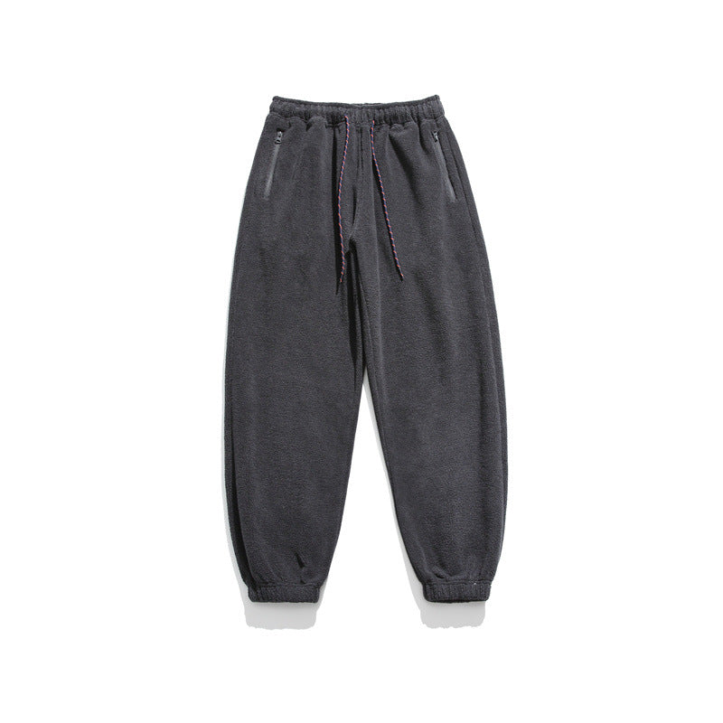 Men's wide-cut fleece jogging pants with elastic cuffs and side pockets Mune Fashion
