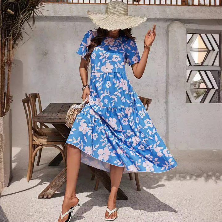 Ladies airy tiered midi dress with high waist seam, short sleeve and all-over floral pattern Mune Fashion