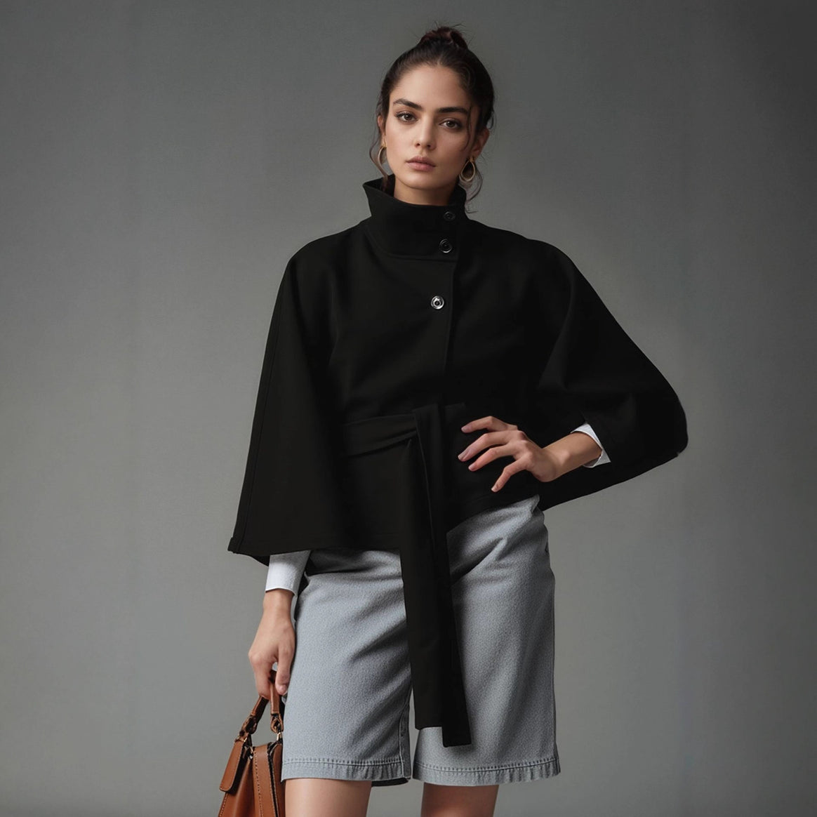 Women's short cape jacket with high stand-up collar, tie belt and boxy silhouette Mune Fashion