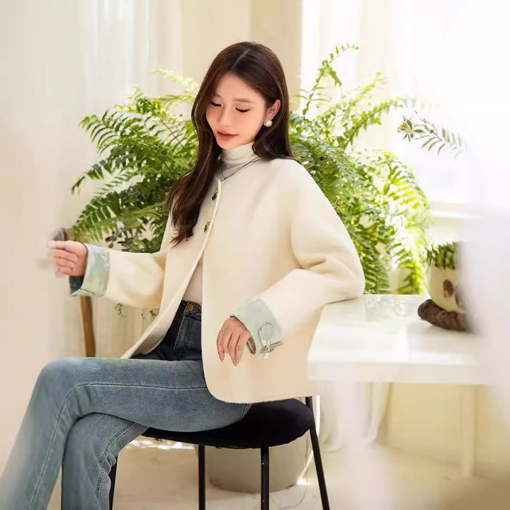 Women's short jacket with stand-up collar, pearl buttons, and contrasting cuffs Mune Fashion