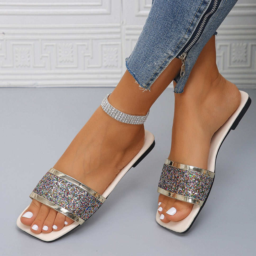 Women's flat slide sandals with a wide glitter strap, square toe area, and padded footbed Mune Fashion