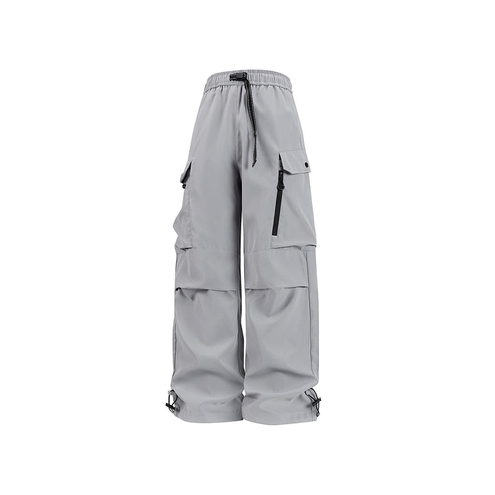 Unisex Wide technical cargo pants with multi-function pockets, drawstring and adjustable leg hems Drune