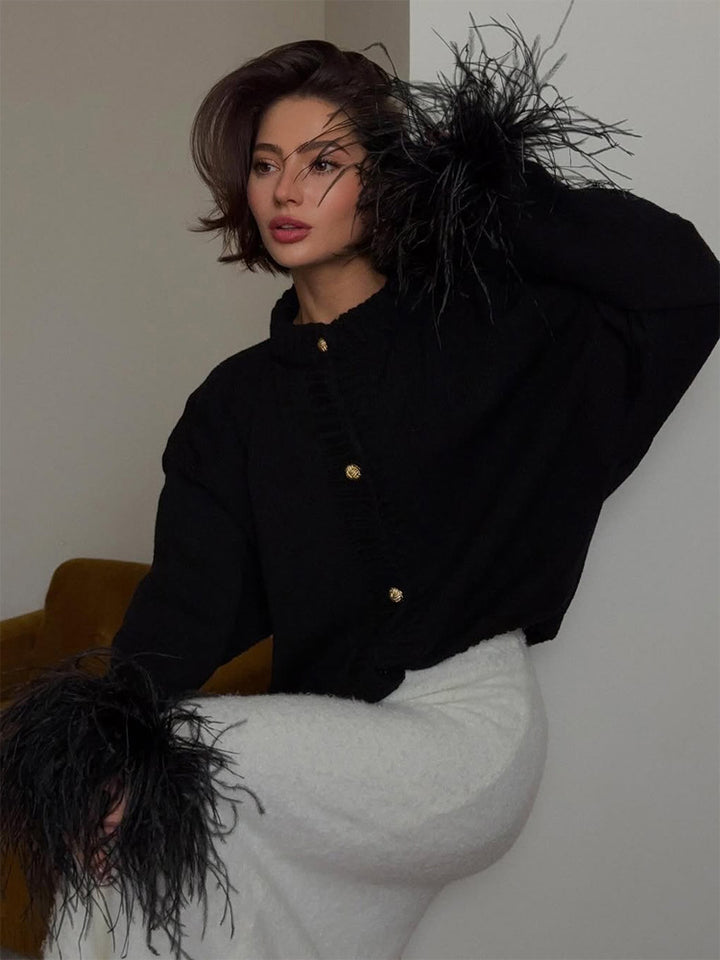Women's knitted cardigan with feather trim at sleeve cuffs and golden decorative buttons Mune Fashion