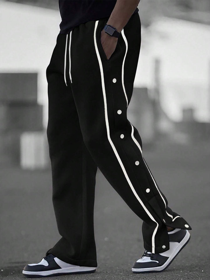 Men's casual training pants with side snap button placket, elastic waistband and contrasting piping Mune Fashion