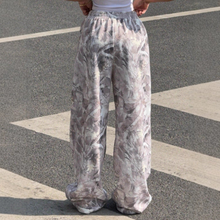 Women's wide Palazzo pants with floral all-over print and elastic waistband Mune Fashion