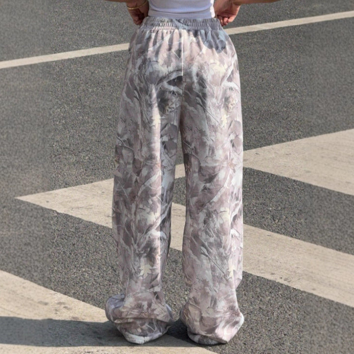 Women's wide Palazzo pants with floral all-over print and elastic waistband Mune Fashion