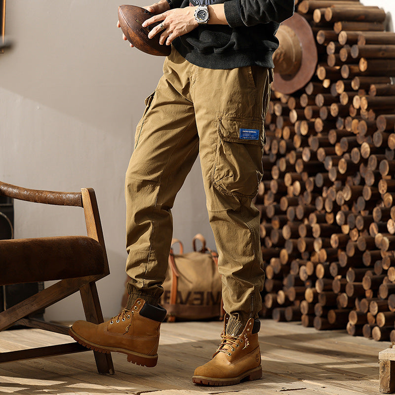 Herren Konisch geschnittene Utility-Cargo-Jogginghose mit Tunnelzugbund, Klapptaschen und Knöchelreißverschlüssen Mune Fashion