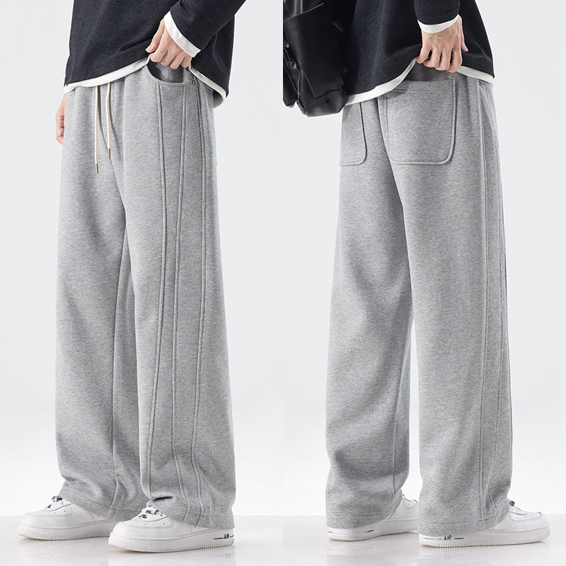 Men's loose sweatpants with decorative seam piping and drawstring