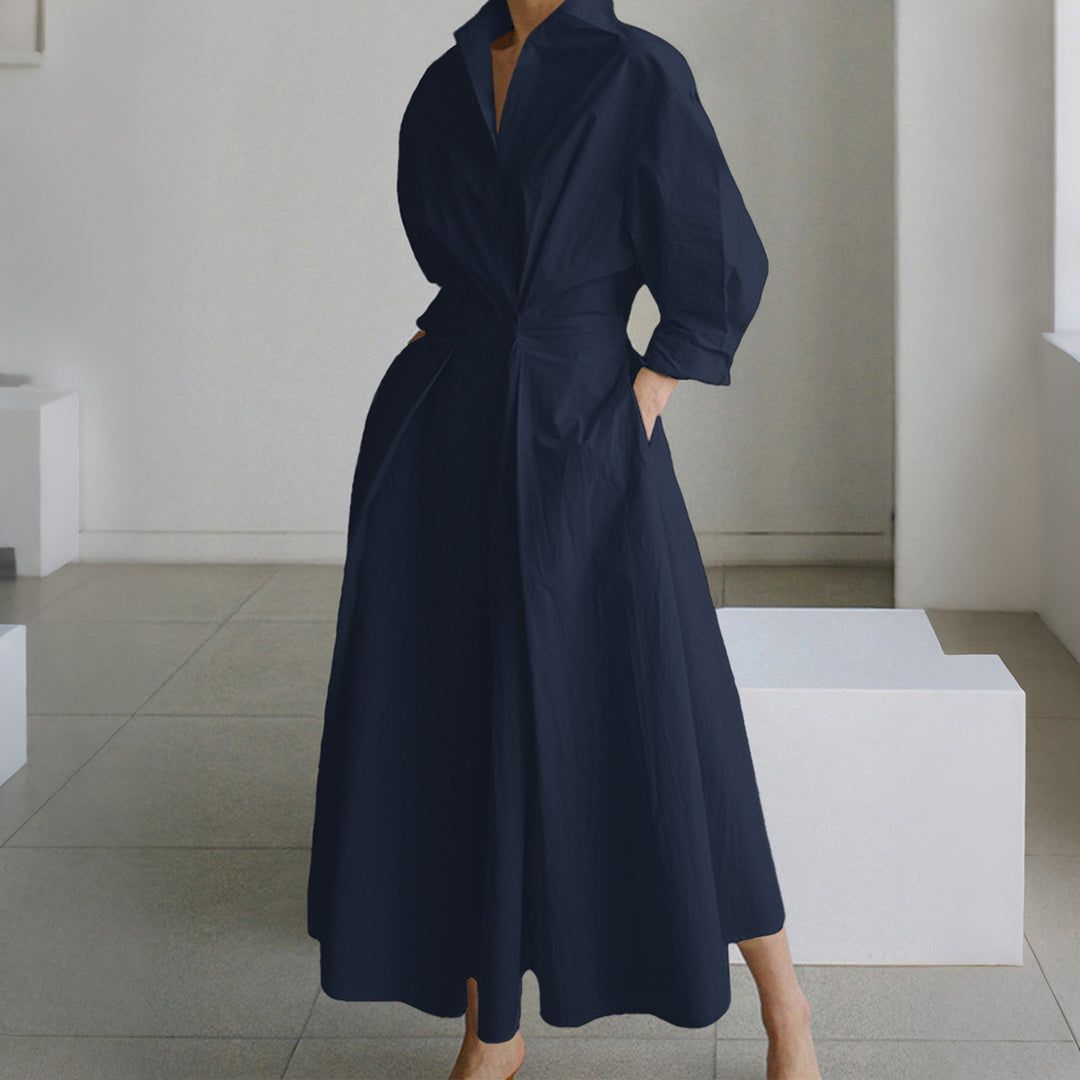 Women's tailored shirt dress with boxy collar, mid-length sleeves, side pockets, and flared pleated skirt Mune Fashion