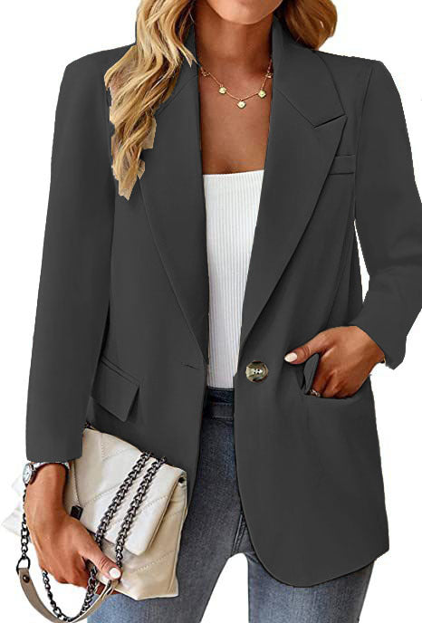 Ladies longline blazer in oversized style with a striking lapel, metal button, and patch pockets Mune Fashion