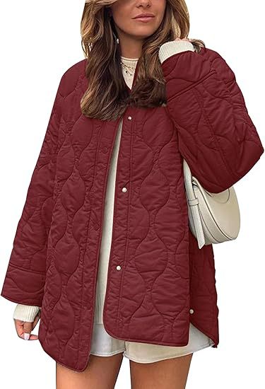 Women's quilted jacket in oversized design with curved quilting and side slit Mune Fashion