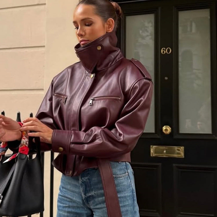 Women's fitted faux leather bomber jacket with high stand collar and tie belt Mune Fashion