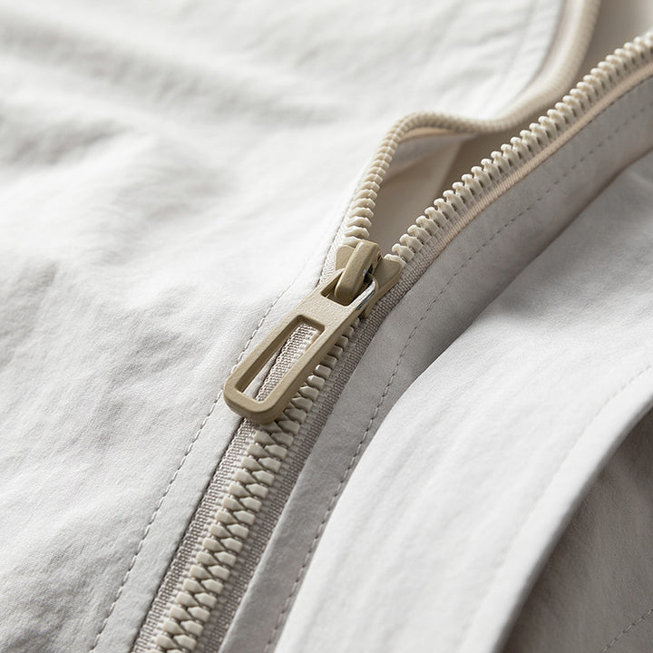 Men's modern utility blouson with standing collar, concealed snap button placket, and elastic hem Mune Fashion