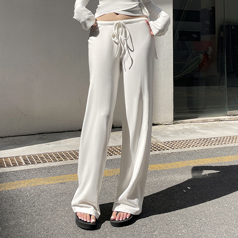 Women's wrap cropped top with deep V-neck, fitted wrap shape, and long bell sleeves Mune Fashion