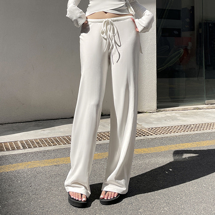 Women's wrap cropped top with deep V-neck, fitted wrap shape, and long bell sleeves Mune Fashion
