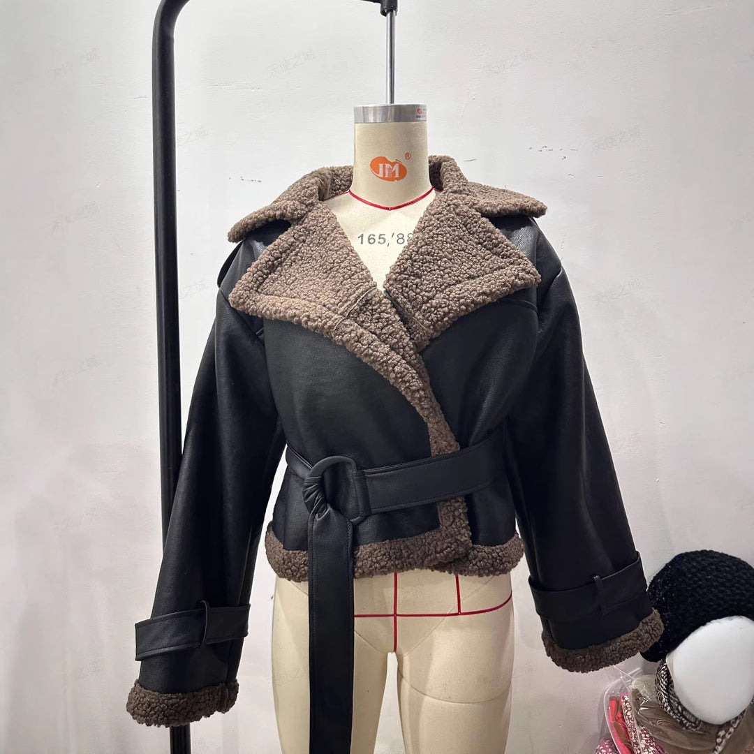 Women's short-cut aviator jacket made of leather look with teddy lining and waist belt Mune Fashion