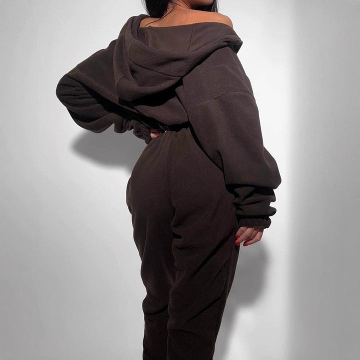 Women's hooded jumpsuit with fitted drawstring, full-length zipper and cuffs