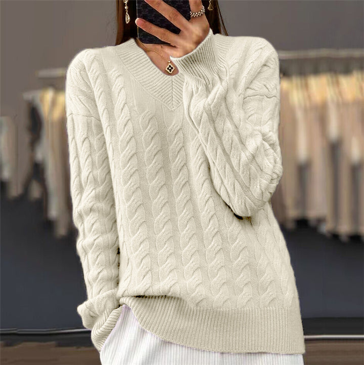 Women's soft draping cable knit sweater with V-neck, oversized cut and ribbed hem Mune Fashion