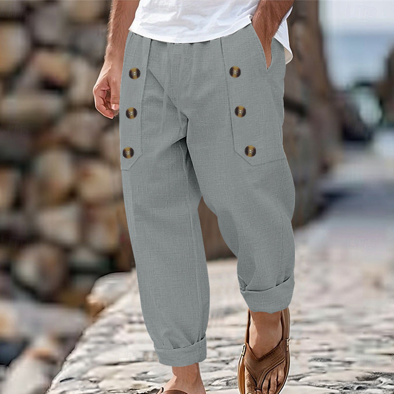 Men's loose linen trousers with decorative button stripes, rolled ankle cuffs, and side pockets Mune Fashion