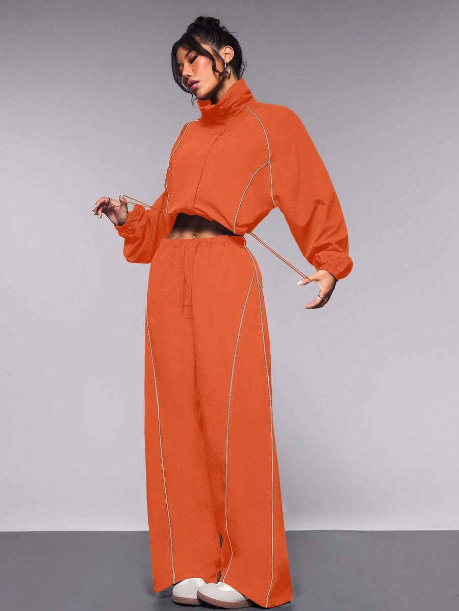 Women's Sportive Cropped Windbreaker Set with Stand-up Collar, Drawstring and Reflective Piping Mune Fashion