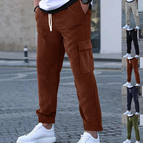Men's corduroy jogger-style pants with elastic drawstring waistband, flap cargo pockets, and tapered leg Mune Fashion