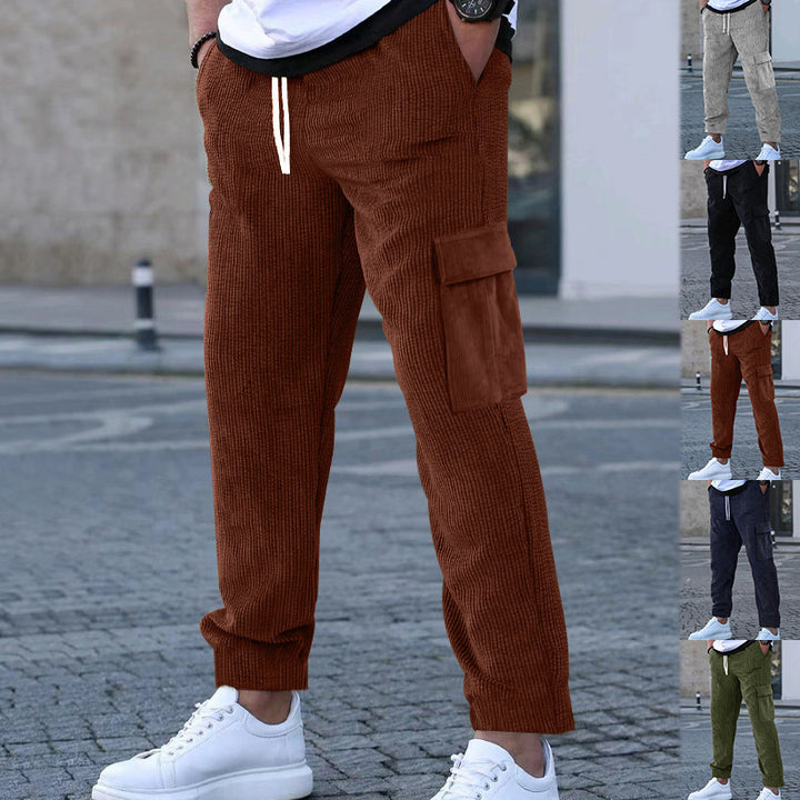 Men's corduroy jogger-style pants with elastic drawstring waistband, flap cargo pockets, and tapered leg Mune Fashion