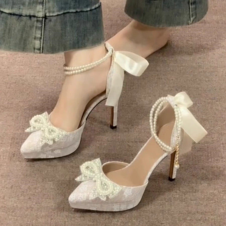 Ladies' satin pumps with lace overlay, pearl bow appliqué, and pearl lacing Mune Fashion