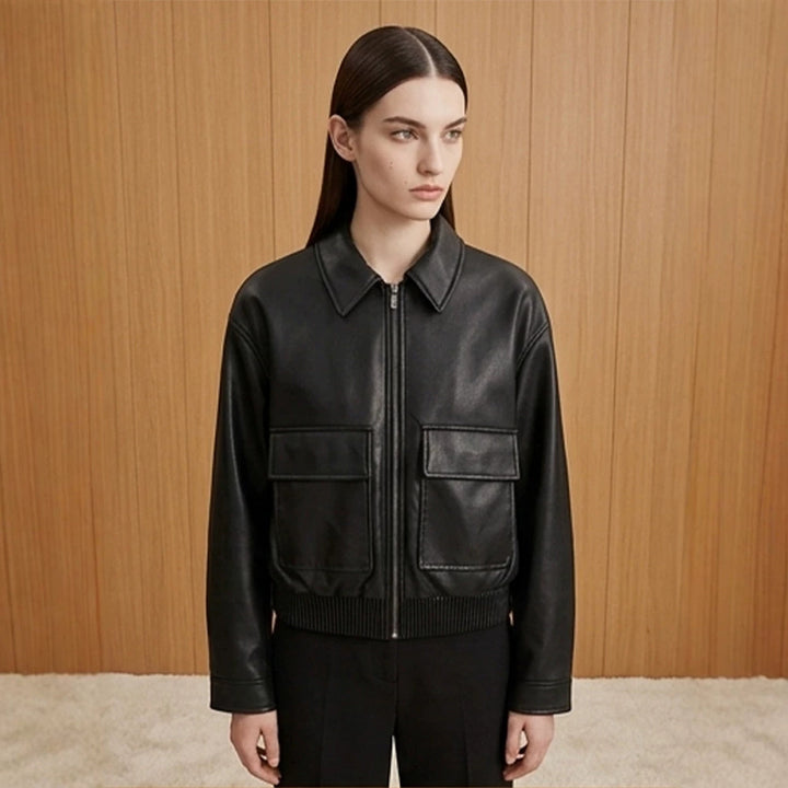 Women's short jacket made of faux leather in bomber style with ribbed hem and patch pockets Mune Fashion