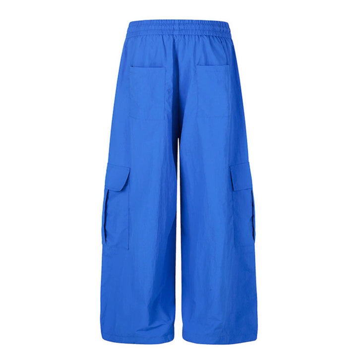 Women's wide palazzo cargo pants with elastic drawstring waistband, large flap pockets, and statement writing print Mune Fashion