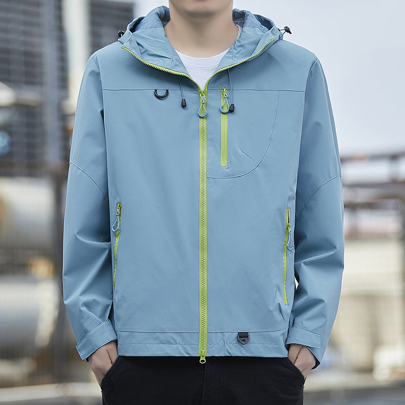 Men's lightweight Urban softshell hoodie jacket with contrasting zippers, chest pocket, and adjustable drawstring hem Mune Fashion