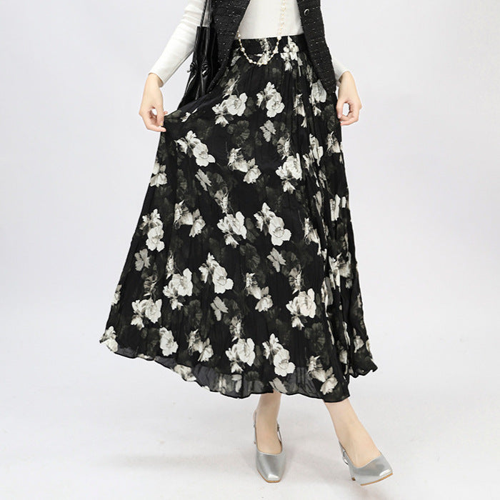 Women's flowing midaxi skirt with asymmetrical wave hem, fine crinkle pleated structure and elastic comfort waistband Mune Fashion